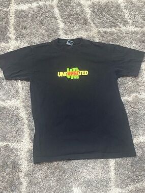 Undefeated Black Tee with Yellow and Green Logo